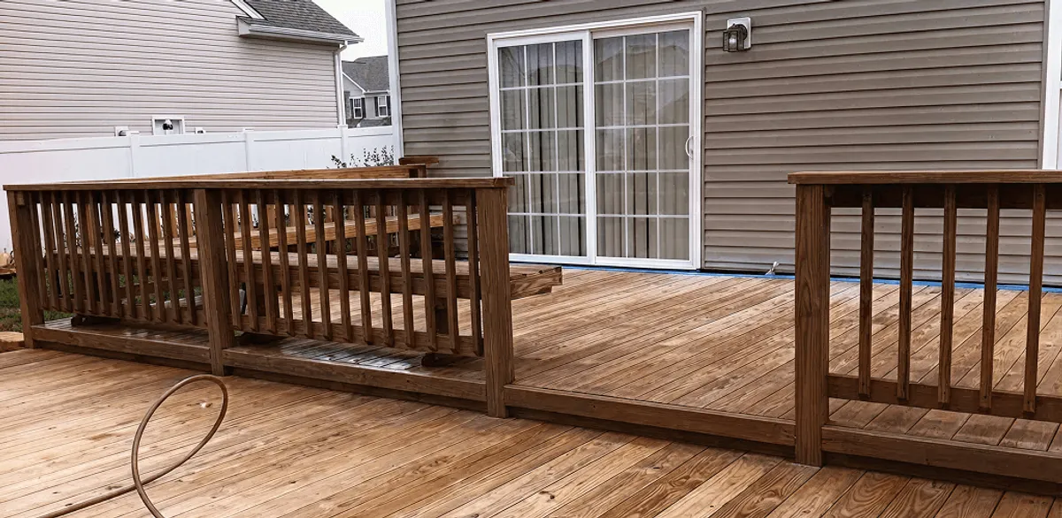 Deck sealing service protecting a backyard wood deck and railings in Honolulu, HI
